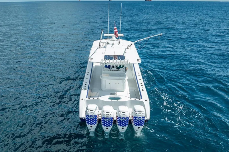  Yacht Photos Pics 2023 Yellowfin 39 Offshore boat with four engines on open sea.