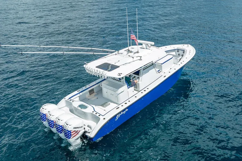  Yacht Photos Pics 2023 Yellowfin 39 Offshore boat with quad engines on open water.