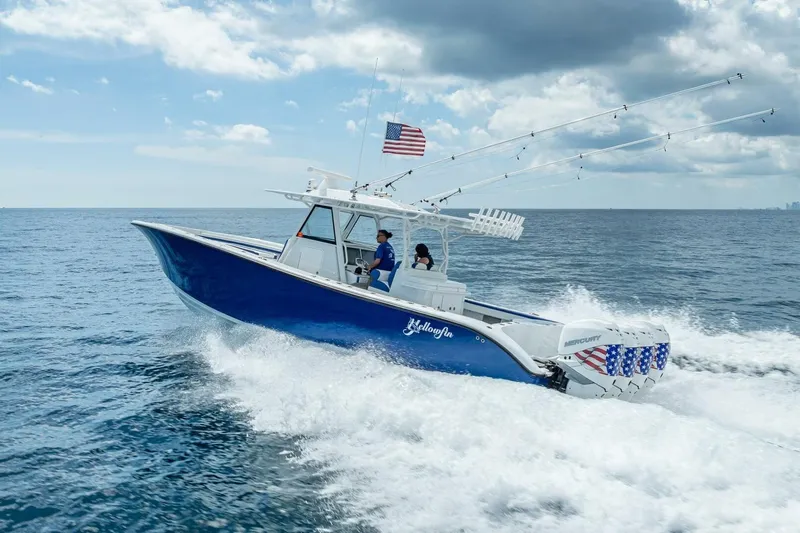  Yacht Photos Pics 2023 Yellowfin 39 Offshore boat cruising on open ocean under cloudy sky.