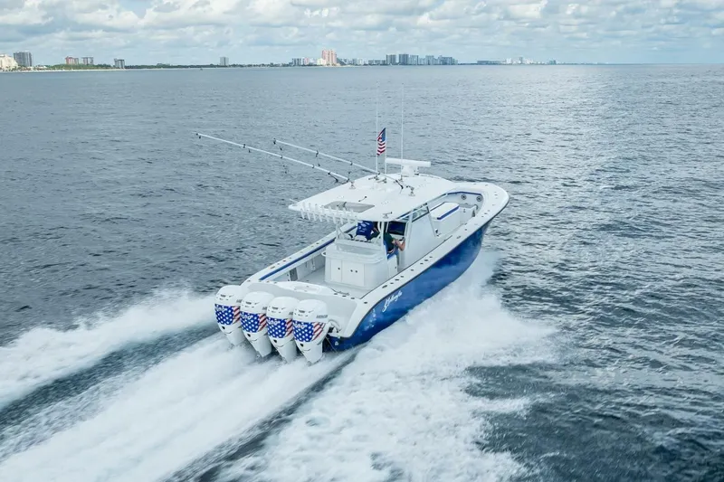 Yacht Photos Pics 2023 Yellowfin 39 Offshore boat cruising on open water, showcasing powerful engines.