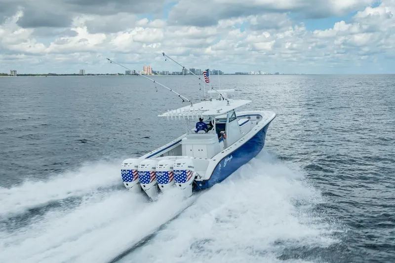  Yacht Photos Pics 2023 Yellowfin 39 Offshore boat cruising on open water under cloudy skies.