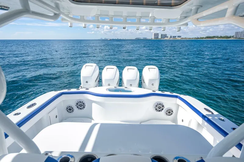  Yacht Photos Pics 2023 Yellowfin 39 Offshore boat with four engines on open sea.