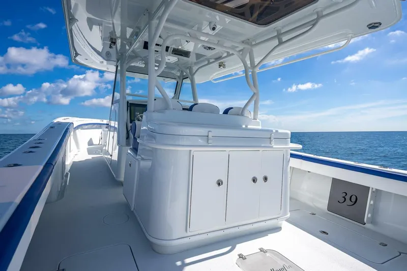  Yacht Photos Pics 2023 Yellowfin 39 Offshore boat interior with ocean view, clear skies, and modern design.