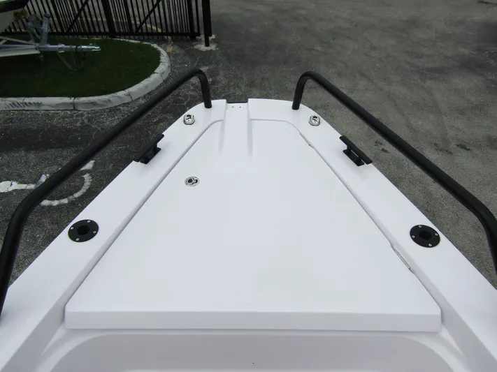  Yacht Photos Pics Bow view of 2024 Axopar 37XC CROSS CABIN, featuring sleek design and sturdy railings.