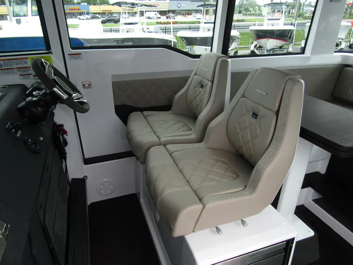  Yacht Photos Pics 2024 Axopar 37XC CROSS CABIN interior with luxurious seating and modern design.