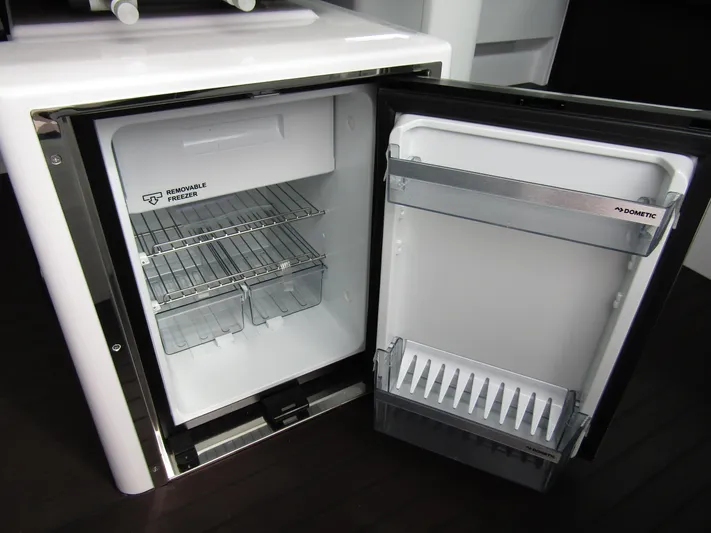  Yacht Photos Pics Open Dometic refrigerator in 2024 Axopar 37XC CROSS CABIN boat.