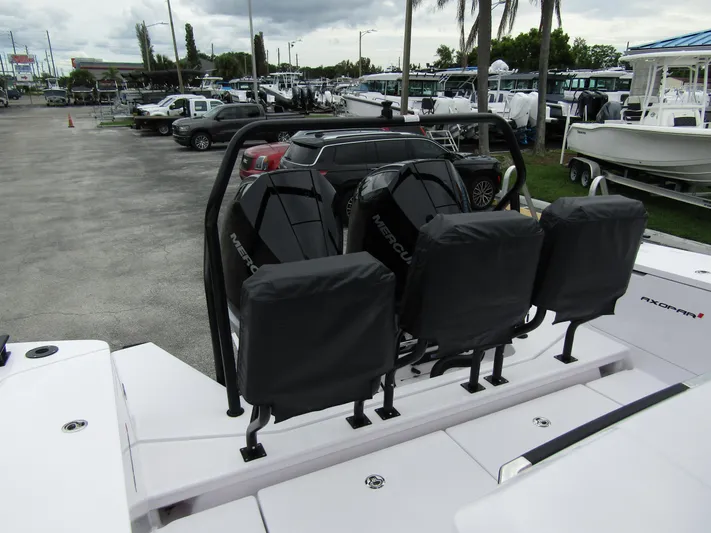  Yacht Photos Pics 2024 Axopar 37XC CROSS CABIN with Mercury engines at a marina.