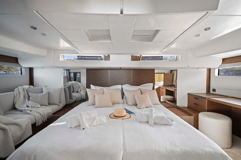  Yacht Photos Pics Luxurious interior of 2024 Prestige M48 yacht with elegant bedding and modern furnishings.