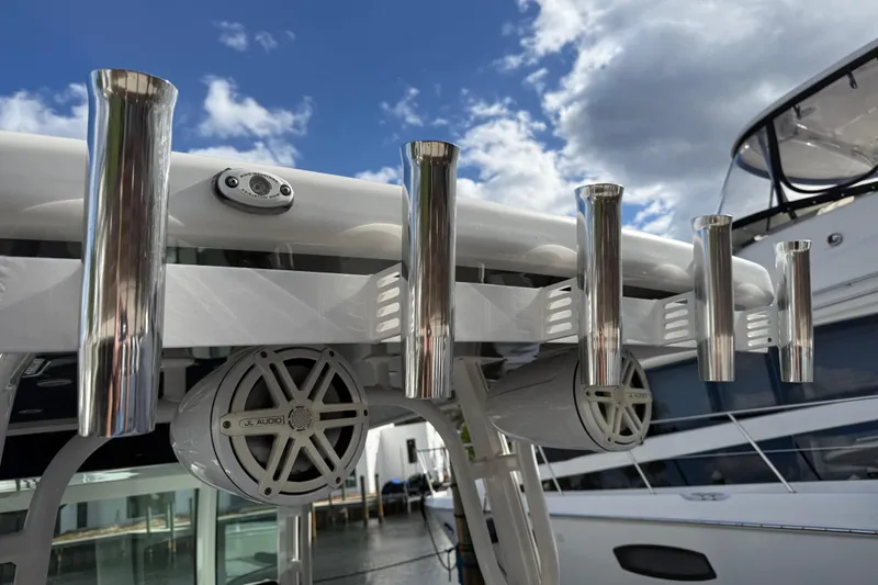 Destroyer Yacht Photos Pics 2018 HCB 39 Speciale boat with rod holders and JL Audio speakers under a blue sky.