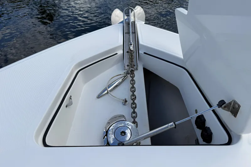 Destroyer Yacht Photos Pics 2018 HCB 39 Speciale boat anchor compartment with chain and winch, near water surface.
