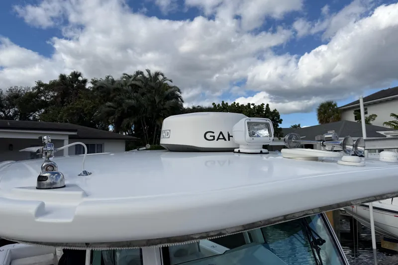 Destroyer Yacht Photos Pics 2018 HCB 39 Speciale boat roof with radar and spotlight under cloudy sky.