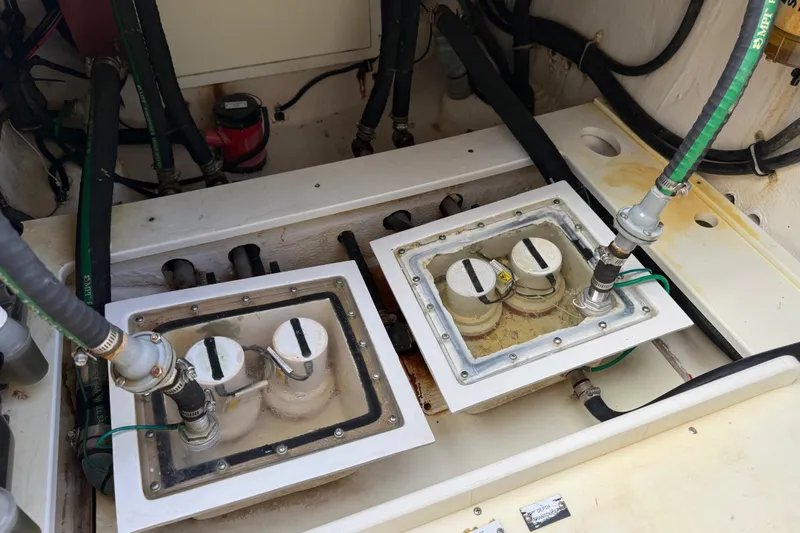 Destroyer Yacht Photos Pics Engine compartment of a 2018 HCB 39 Speciale boat, showing fuel filters and hoses.