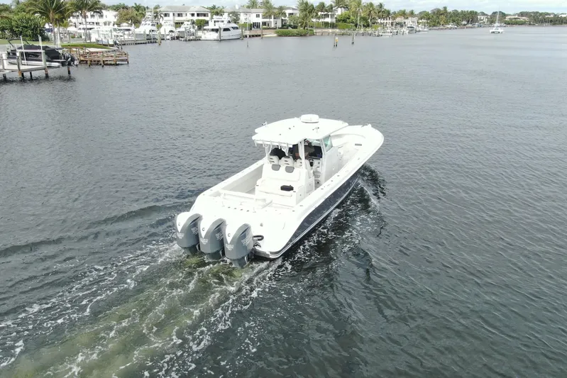Destroyer Yacht Photos Pics 2018 HCB 39 Speciale boat cruising on a calm waterway.