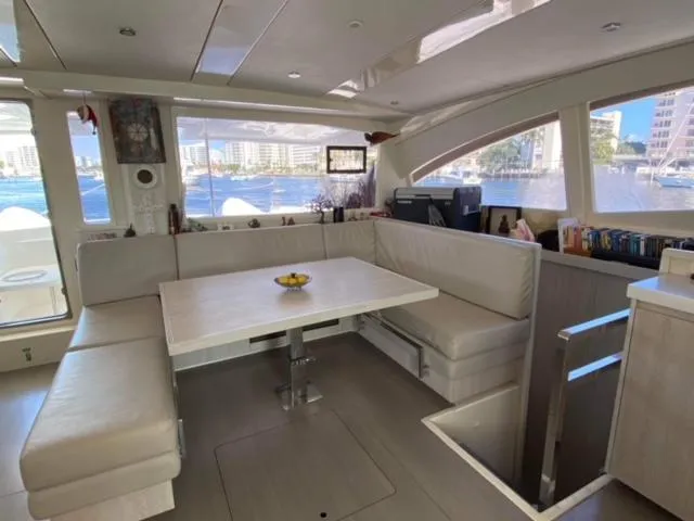 Balance Yacht Photos Pics Luxurious interior of a 2016 Leopard 48 yacht with spacious seating and waterfront view.