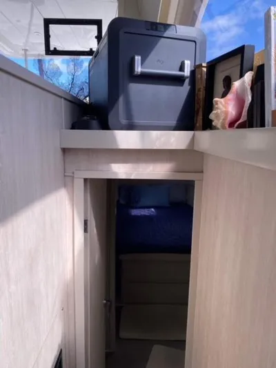 Balance Yacht Photos Pics Interior of 2016 Leopard 48 yacht with storage and bedroom access.