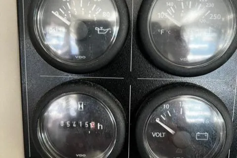 Balance Yacht Photos Pics Close-up of Leopard 48 yacht gauges, displaying oil, temperature, hours, and voltage readings.