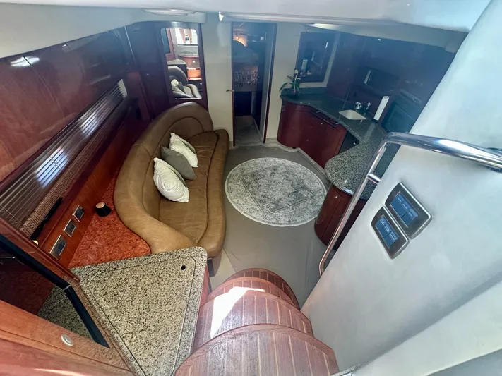  Yacht Photos Pics Luxurious interior of 2005 Sea Ray 420 Sundancer yacht with elegant seating and modern kitchen.