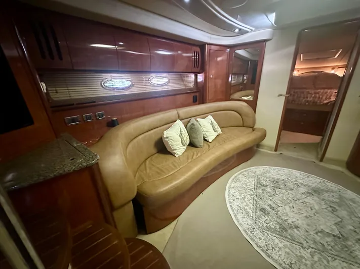  Yacht Photos Pics Luxurious interior of 2005 Sea Ray 420 Sundancer yacht with leather seating and elegant decor.