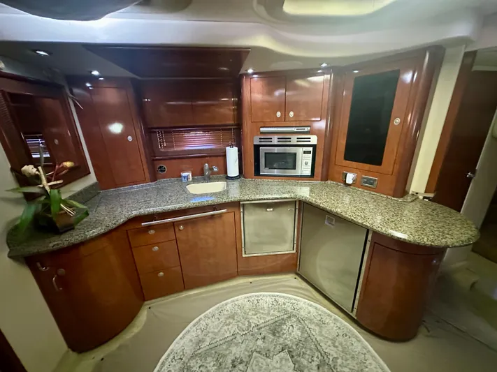  Yacht Photos Pics Luxurious kitchen interior of 2005 Sea Ray 420 Sundancer yacht with granite countertops.