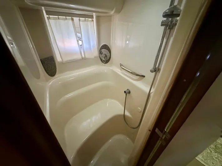  Yacht Photos Pics Bathroom interior of 2005 Sea Ray 420 Sundancer yacht with shower and curtain.