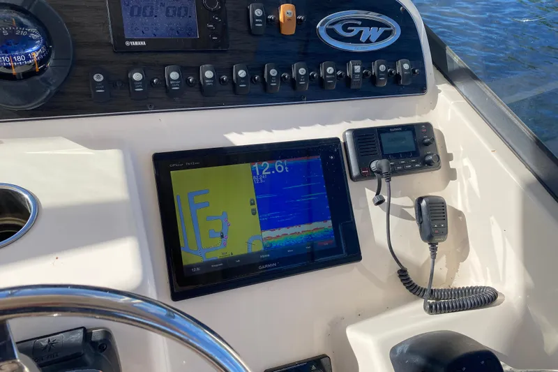  Yacht Photos Pics Dashboard of 2015 Grady-White Freedom 285 boat with navigation and communication equipment.