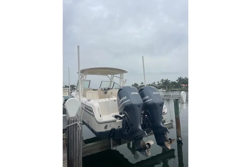  Yacht Photos Pics 2015 Grady-White Freedom 285 boat with twin Yamaha engines docked.