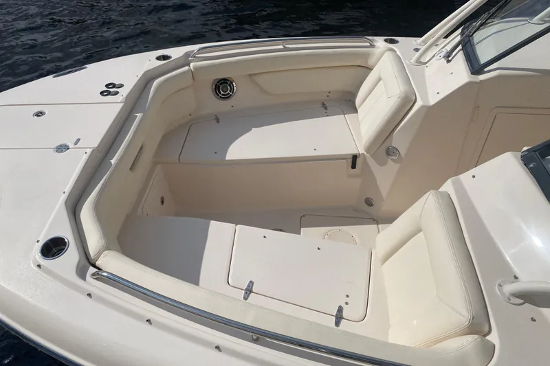  Yacht Photos Pics 2015 Grady-White Freedom 285 boat interior with cushioned seating and storage compartments.