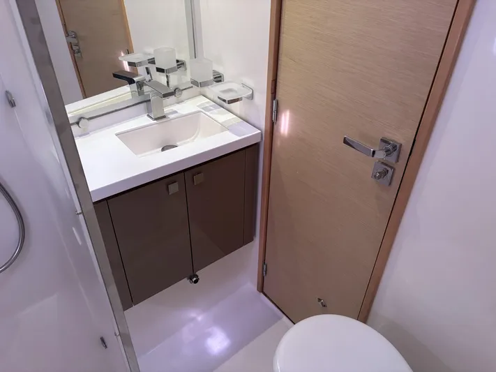Adventure For Seven Yacht Photos Pics Bathroom interior of 2017 Fountaine Pajot Ipanema 58 yacht, featuring modern sink and fixtures.