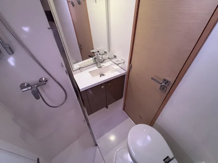 Adventure For Seven Yacht Photos Pics Bathroom interior of 2017 Fountaine Pajot Ipanema 58 yacht, featuring shower and sink.