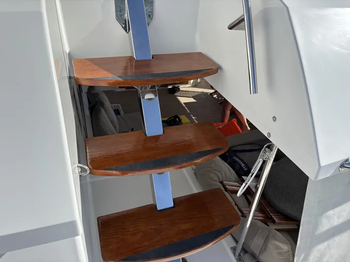 Adventure For Seven Yacht Photos Pics Wooden steps on a 2017 Fountaine Pajot Ipanema 58 yacht interior.
