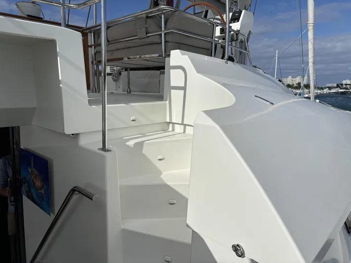 Adventure For Seven Yacht Photos Pics 2017 Fountaine Pajot Ipanema 58 yacht with sleek white deck and stairs.