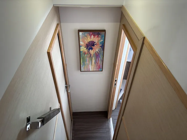 Adventure For Seven Yacht Photos Pics Interior hallway of 2017 Fountaine Pajot Ipanema 58 with colorful wall art.