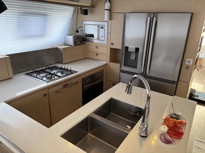 Adventure For Seven Yacht Photos Pics Modern kitchen in 2017 Fountaine Pajot Ipanema 58 yacht with stainless steel appliances.