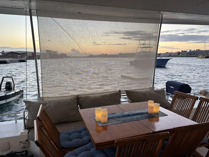 Adventure For Seven Yacht Photos Pics Luxurious 2017 Fountaine Pajot Ipanema 58 yacht with elegant dining area at sunset.