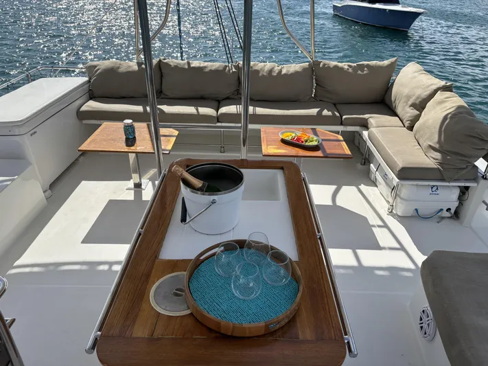 Adventure For Seven Yacht Photos Pics Luxurious 2017 Fountaine Pajot Ipanema 58 yacht deck with seating and refreshments.