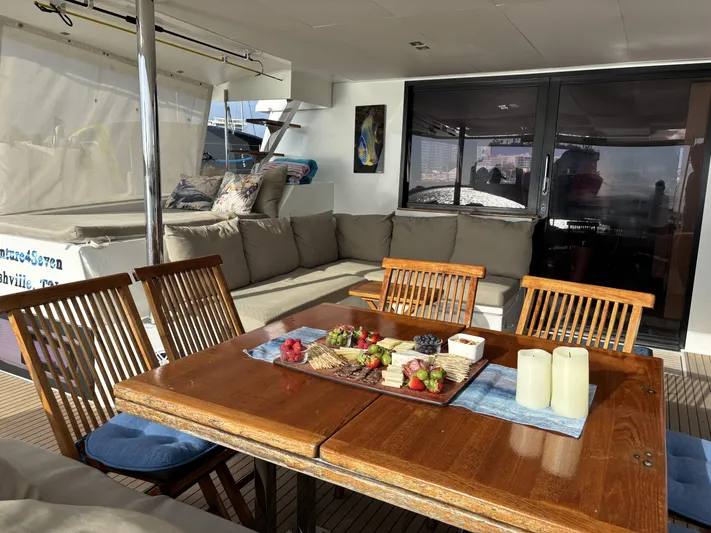 Adventure For Seven Yacht Photos Pics Luxurious 2017 Fountaine Pajot Ipanema 58 yacht with elegant outdoor dining area.