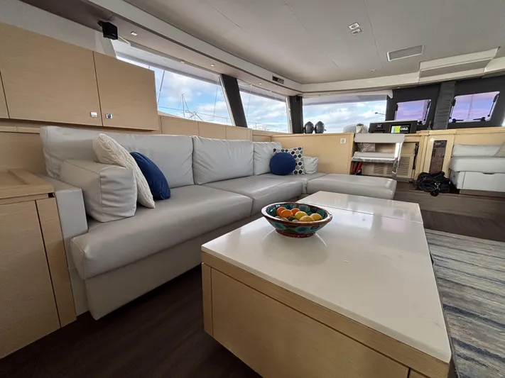 Adventure For Seven Yacht Photos Pics Luxurious interior of 2017 Fountaine Pajot Ipanema 58 catamaran with modern furnishings.