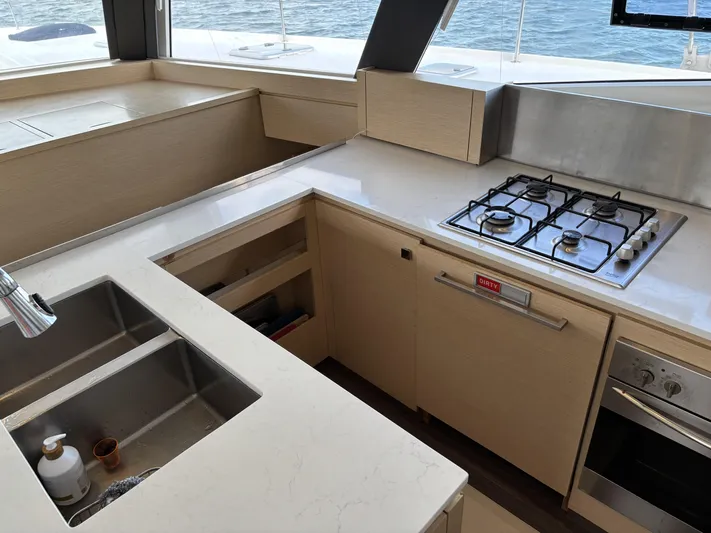 Adventure For Seven Yacht Photos Pics Modern kitchen on 2017 Fountaine Pajot Ipanema 58 yacht with stove and sink.