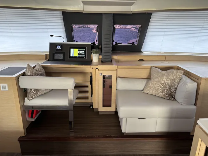 Adventure For Seven Yacht Photos Pics Interior of 2017 Fountaine Pajot Ipanema 58 yacht with modern seating and navigation equipment.