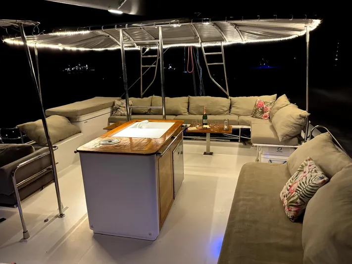 Adventure For Seven Yacht Photos Pics Luxurious 2017 Fountaine Pajot Ipanema 58 yacht interior with elegant seating and ambient lighting.