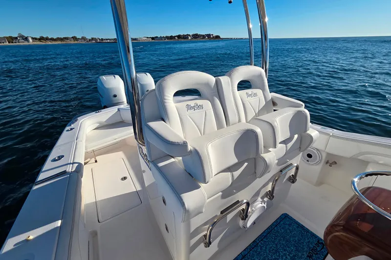 Sugar Mags Yacht Photos Pics 2022 Mag Bay 33 CC boat interior with white seating on open water.