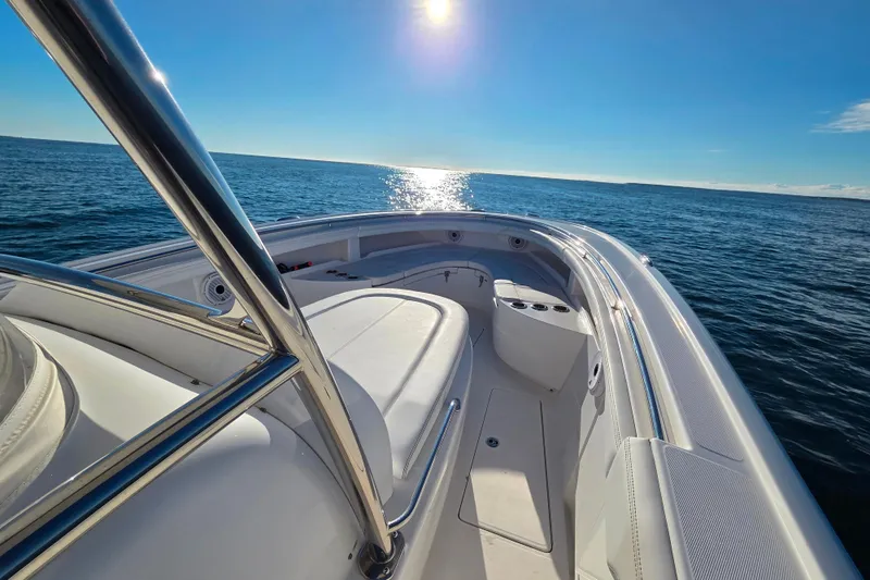 Sugar Mags Yacht Photos Pics 2022 Mag Bay 33 CC boat on open sea under clear blue sky.