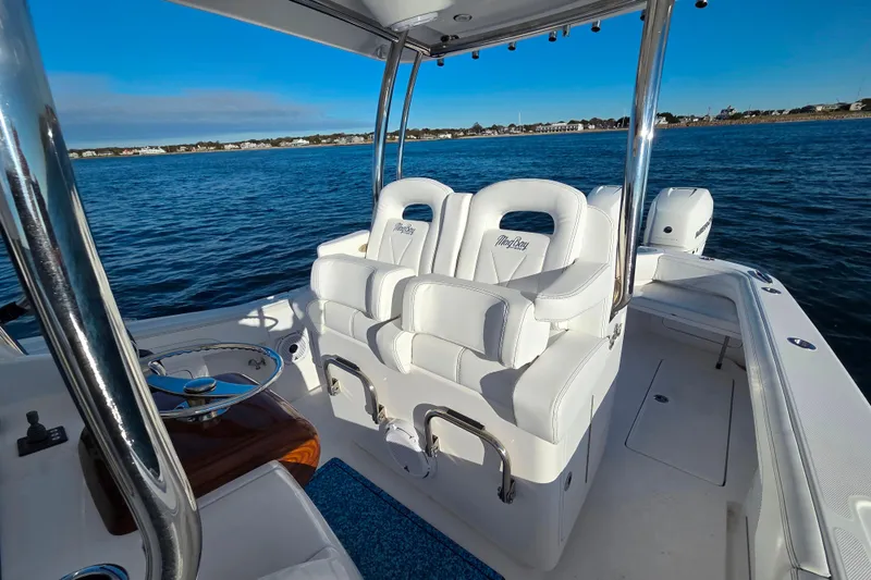 Sugar Mags Yacht Photos Pics 2022 Mag Bay 33 CC boat interior with white seating on open water.
