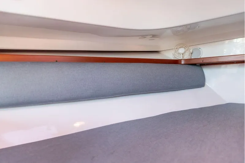 Battendown Yacht Photos Pics Interior cabin view of 2007 Hunt Surfhunter 29 boat with gray upholstery.
