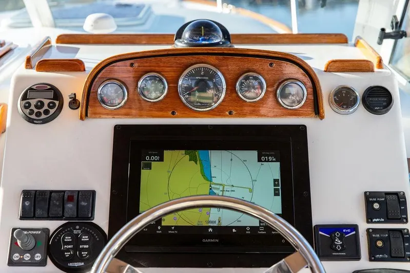 Battendown Yacht Photos Pics Dashboard of a 2007 Hunt Surfhunter 29 boat with navigation instruments and controls.