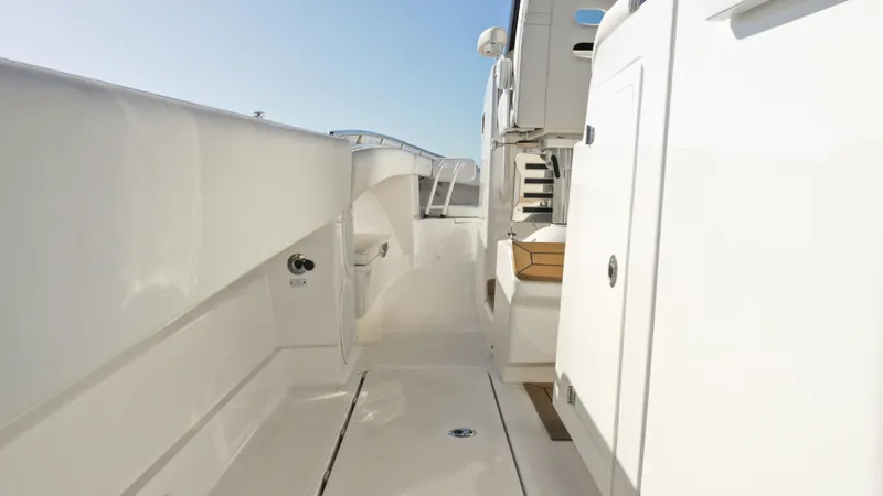  Yacht Photos Pics 2022 HCB 42 Lujo yacht interior walkway, sleek white design.