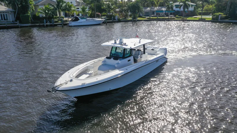  Yacht Photos Pics 2022 HCB 42 Lujo boat cruising on a sunny waterway.