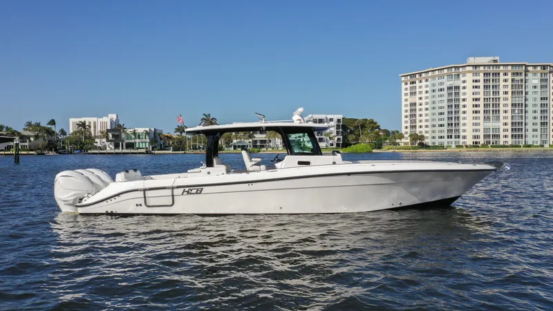  Yacht Photos Pics 2022 HCB 42 Lujo boat on water, cityscape background.