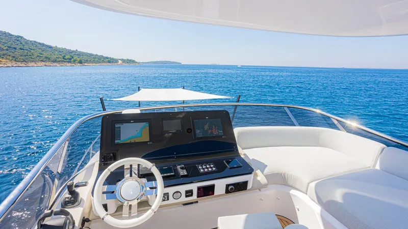 Genesis Yacht Photos Pics 2023 Azimut Fly 60 yacht helm with ocean view and modern navigation equipment.