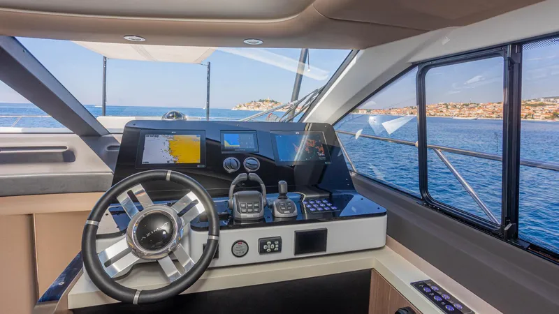 Genesis Yacht Photos Pics 2023 Azimut Fly 60 yacht cockpit with modern navigation controls and ocean view.